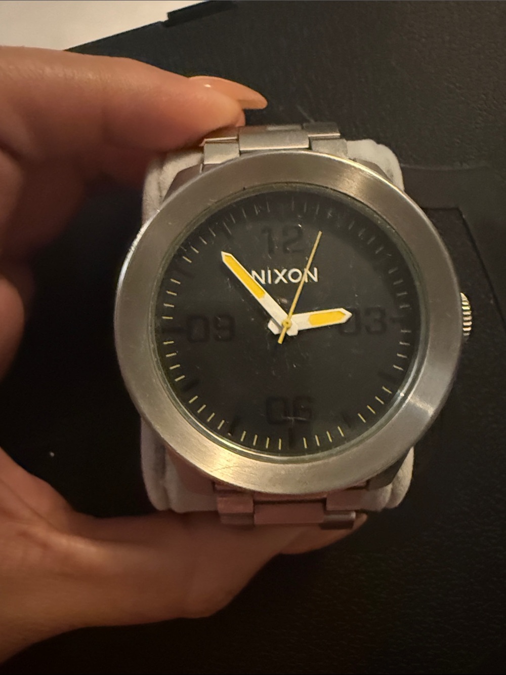 Nixon Stainless Steel Watch with Black Dial and Yellow Hands no battery